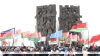 Камень и цветы. У монумента "Врата памяти" в Тростенце прошел митинг-реквием